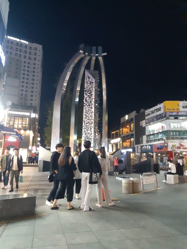 Crowds enjoying late-night busking at the pedestrian mall in downtown Uijeongbu, South Korea.